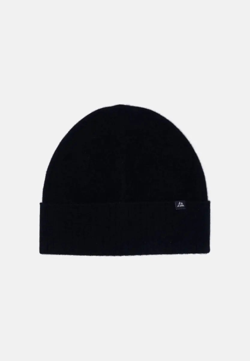 Black 100% cashmere beanie with folded brim and small side logo, on a white background.