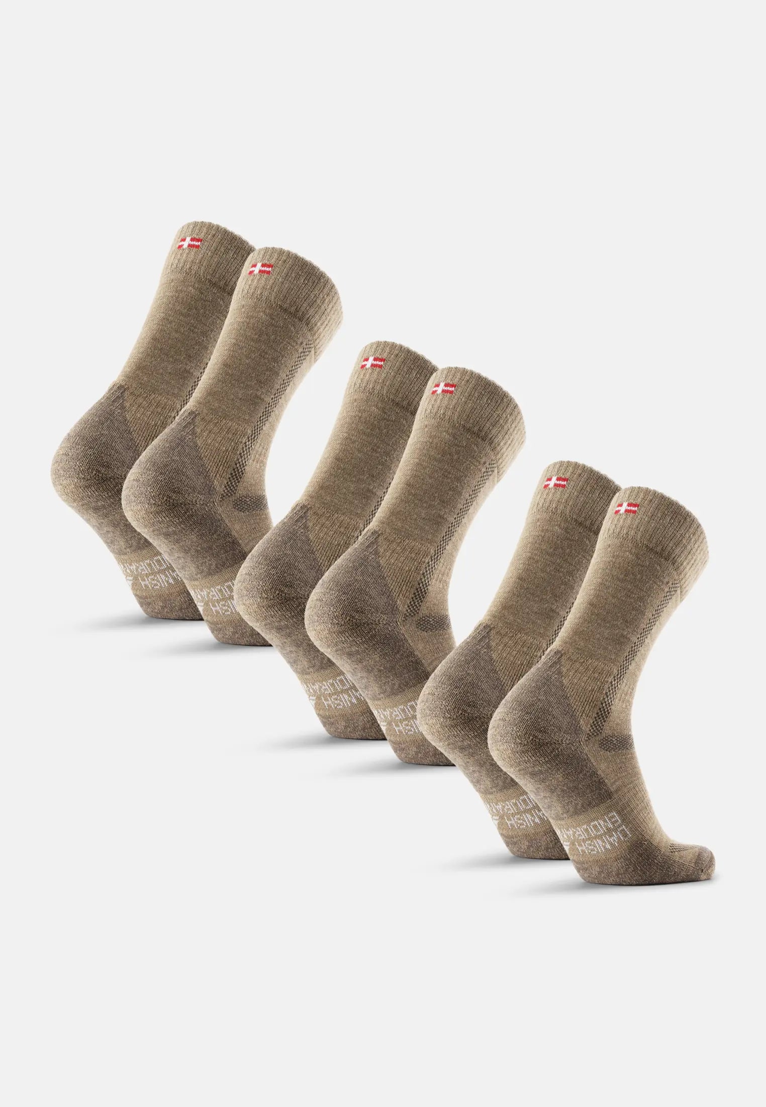 Five pairs of brown merino wool hiking socks with flag detail on the cuff.