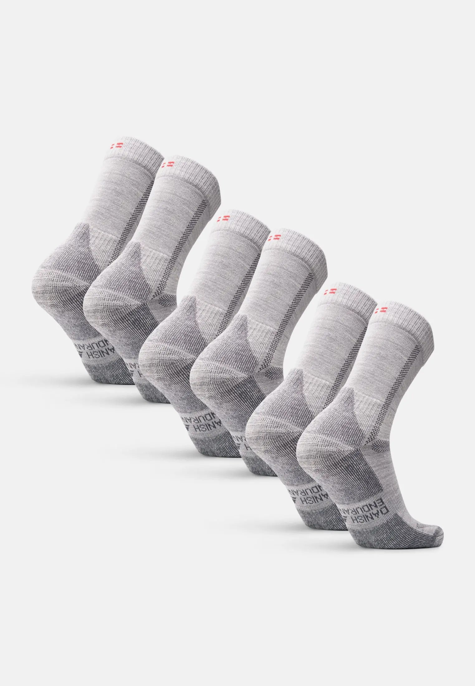 Six pairs of gray kids' merino wool hiking socks with reinforced heels and toes.