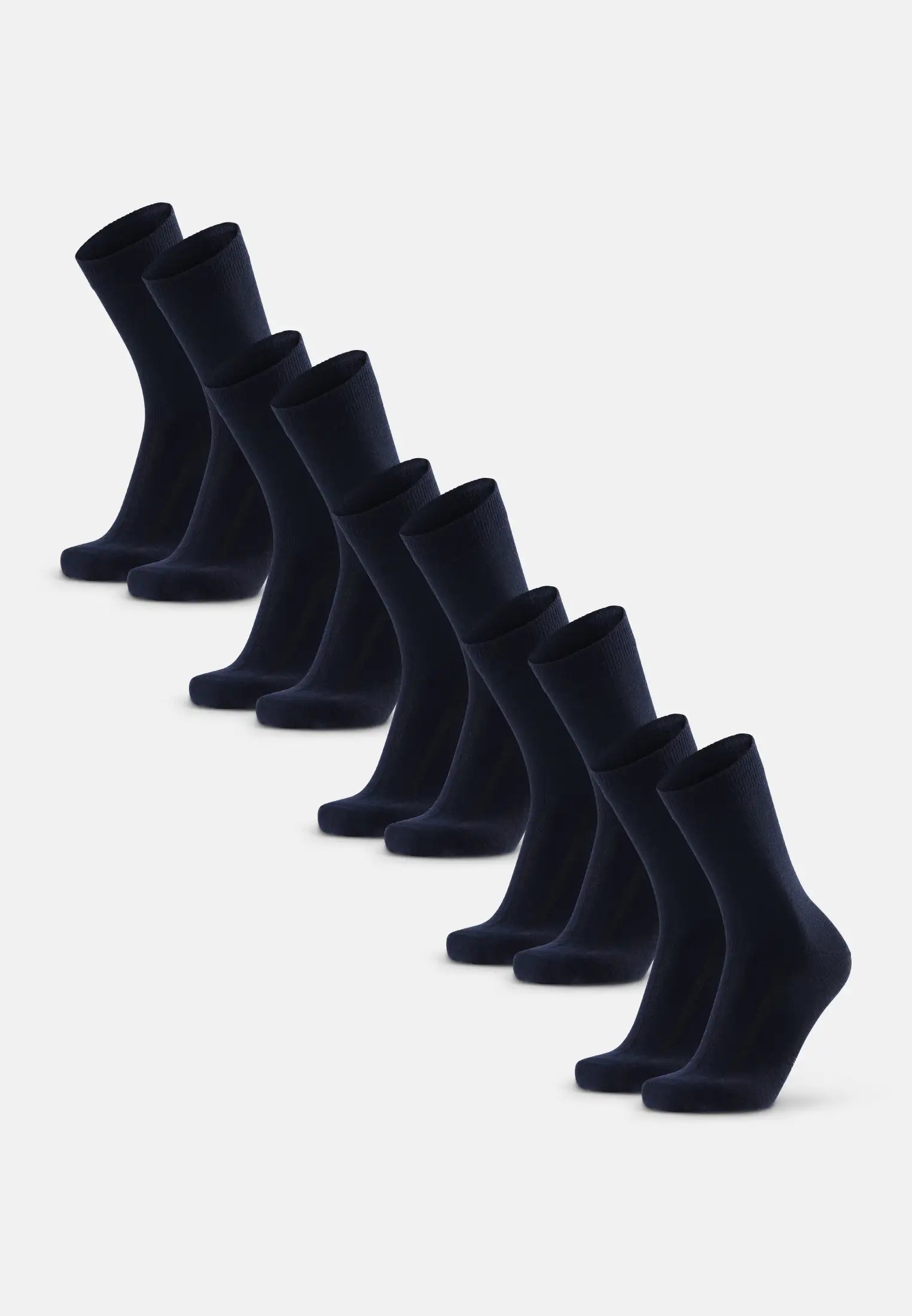 A row of dark merino dress socks aligned diagonally on a white background.