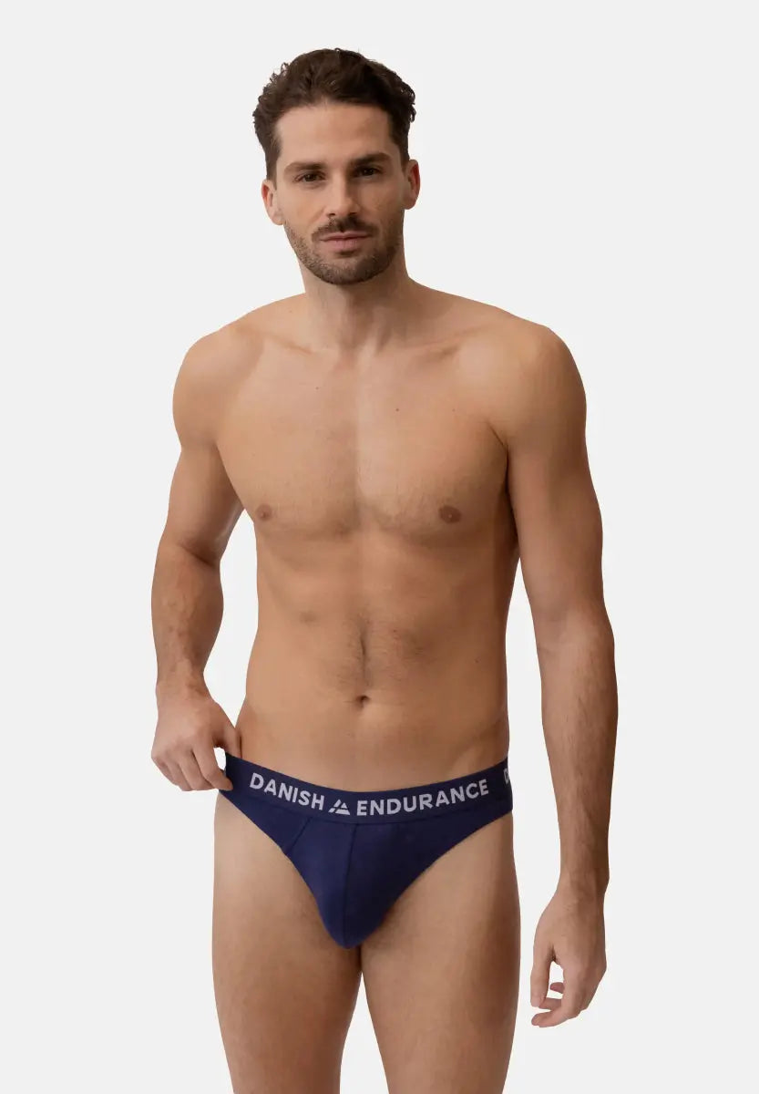 Man wearing navy blue bamboo briefs with DANISH ENDURANCE waistband.