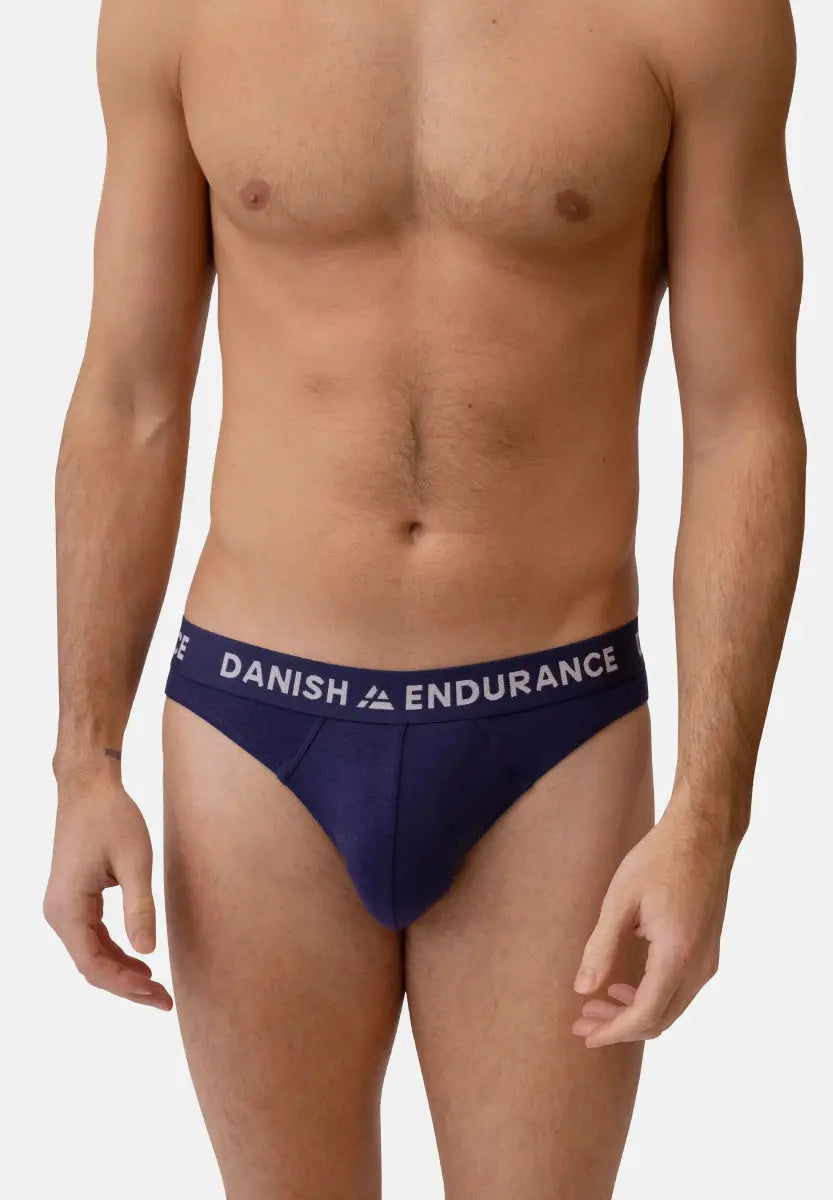 Person wearing dark blue briefs with "DANISH ENDURANCE" waistband on a neutral background.