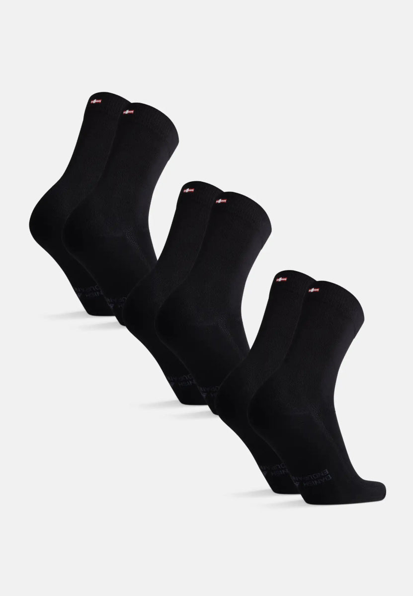 Set of five pairs of black bamboo dress socks, arranged in a row on a white background.