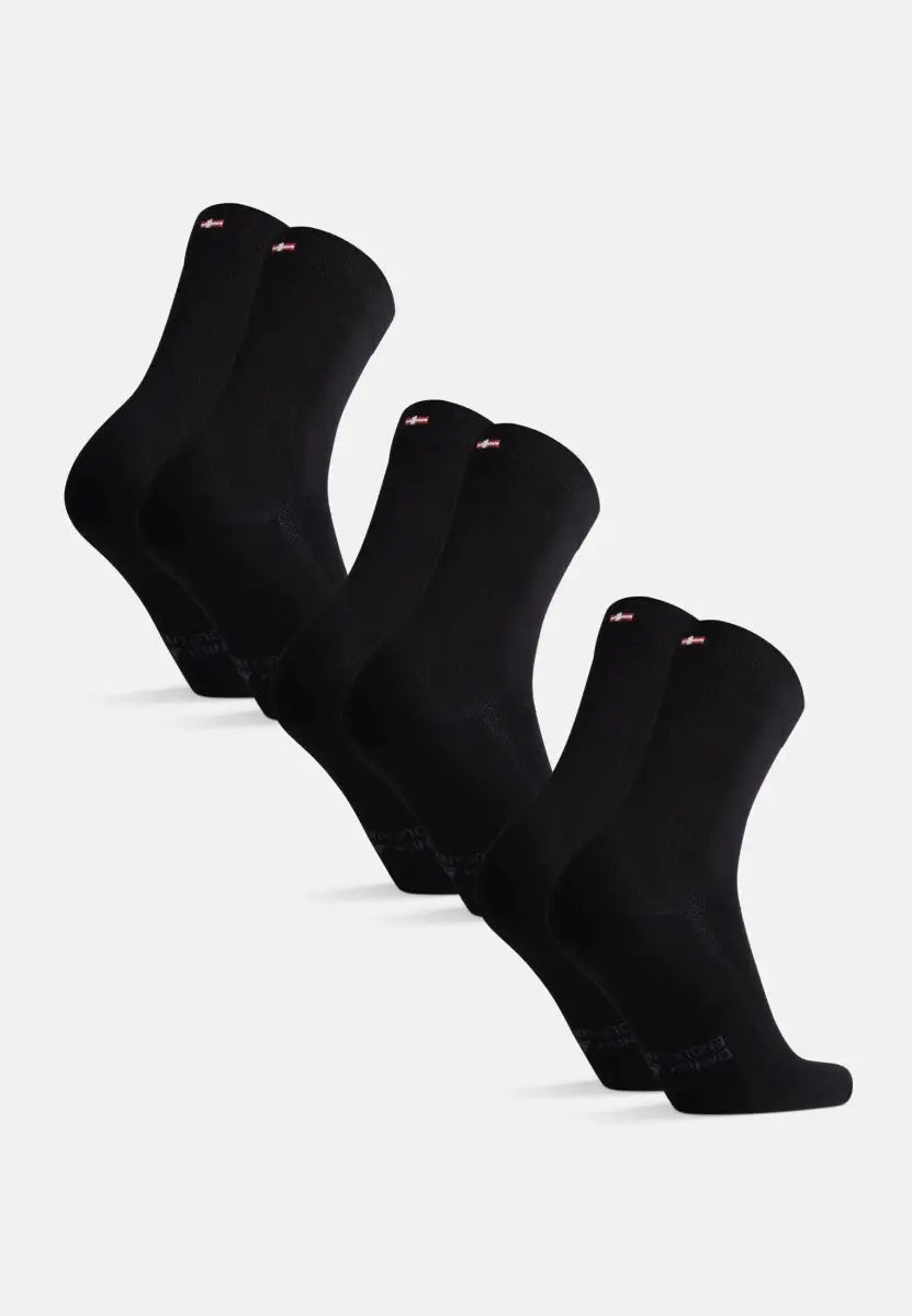 Set of five pairs of black bamboo dress socks, arranged in a row on a white background.