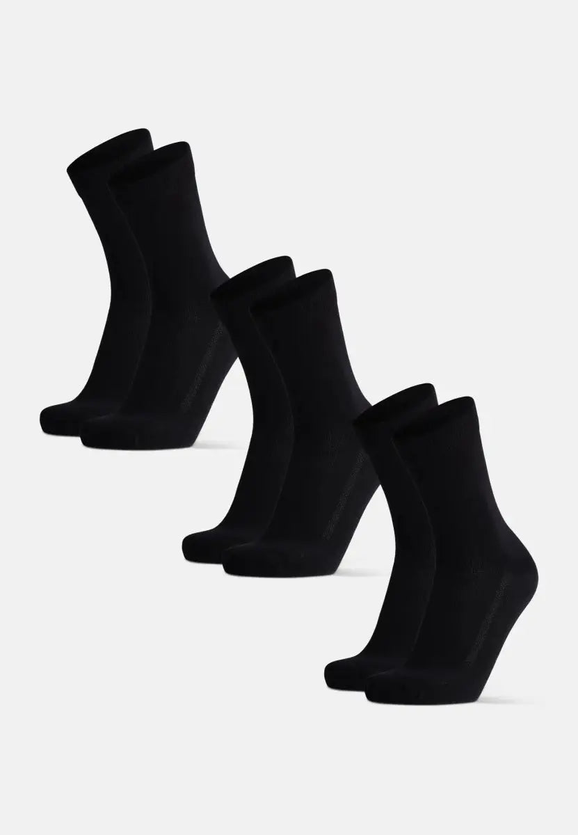 Five pairs of black bamboo dress socks aligned on a white background.