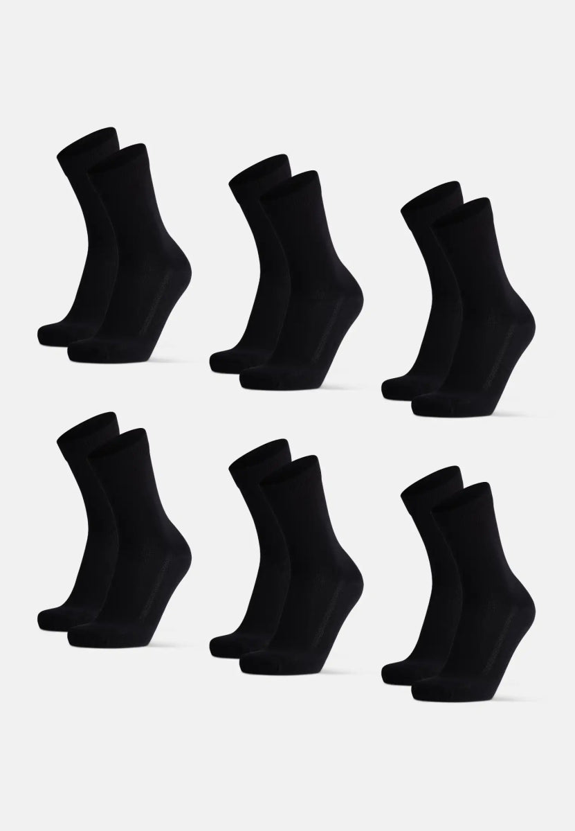 Six pairs of black bamboo dress socks arranged neatly on a white background.