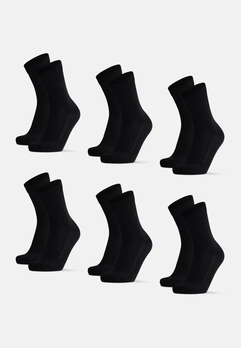 Six pairs of black bamboo dress socks arranged neatly on a white background.