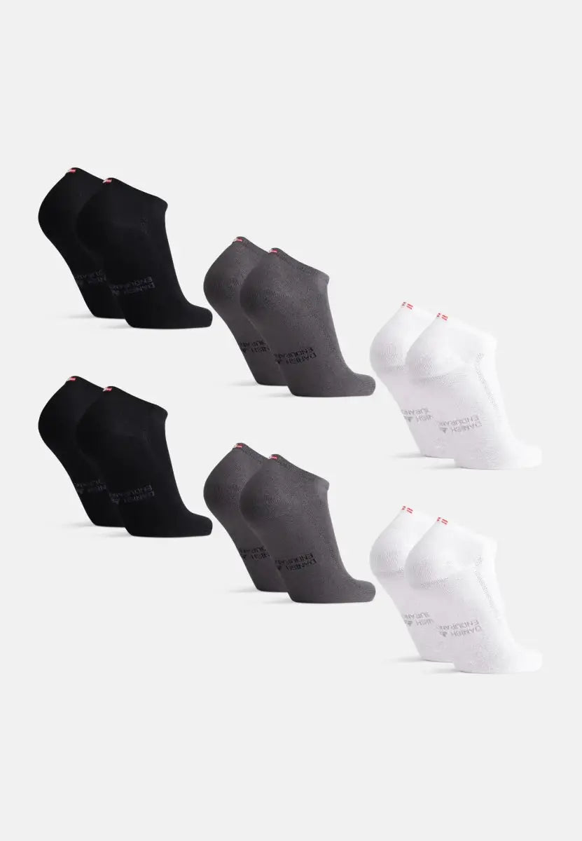 Three pairs of bamboo low-cut socks in black, gray, and white, arranged in two rows.