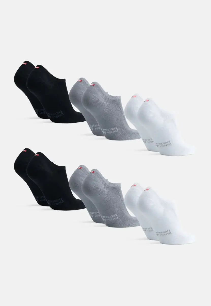 Three pairs of bamboo no-show socks in black, gray, and white, displayed side by side.