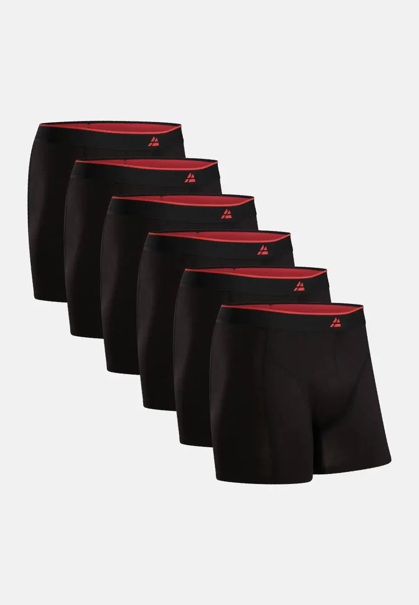 Set of six black bamboo trunks with red waistband and logo, arranged in a row.