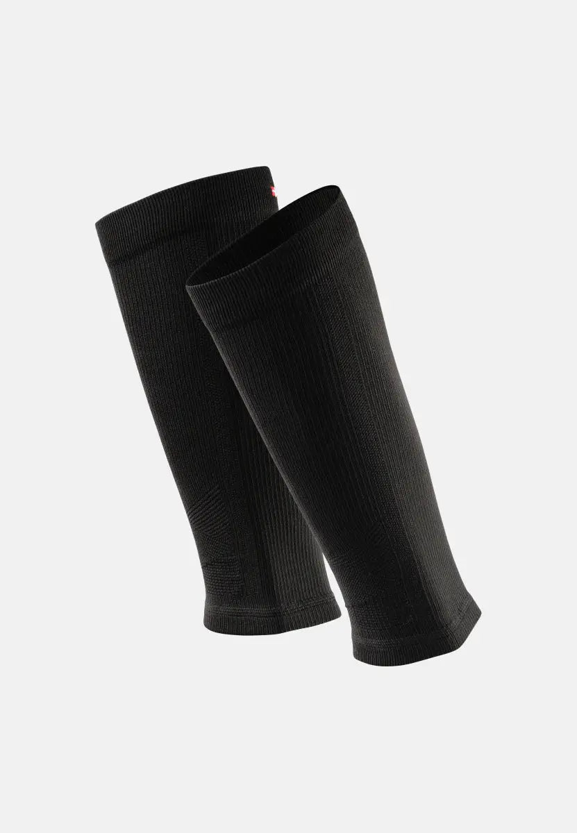Two black ribbed calf compression sleeves overlapping on a plain background.