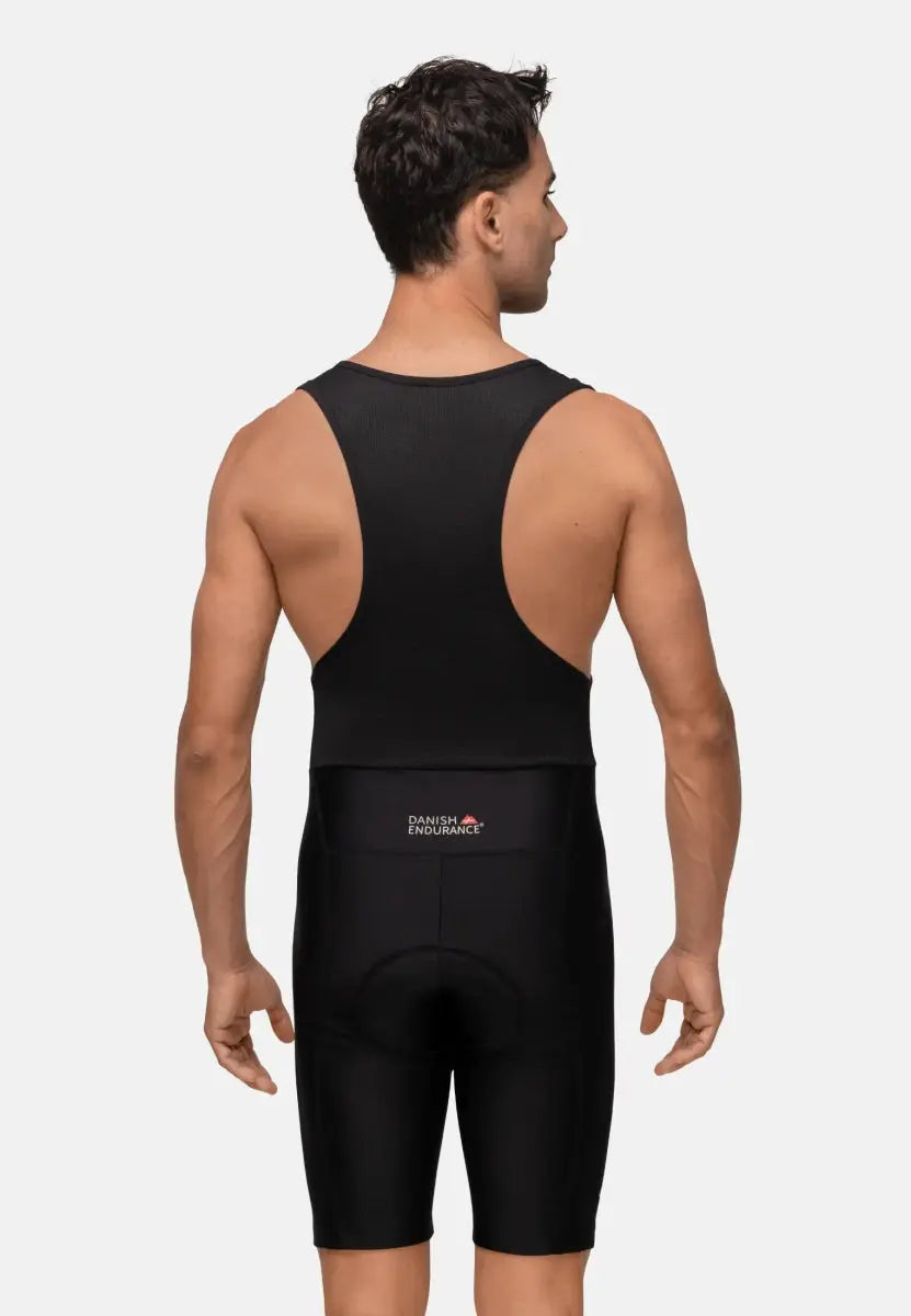 Man in black cycling bib shorts, viewed from the back, with "Danish Endurance" logo on the shorts.
