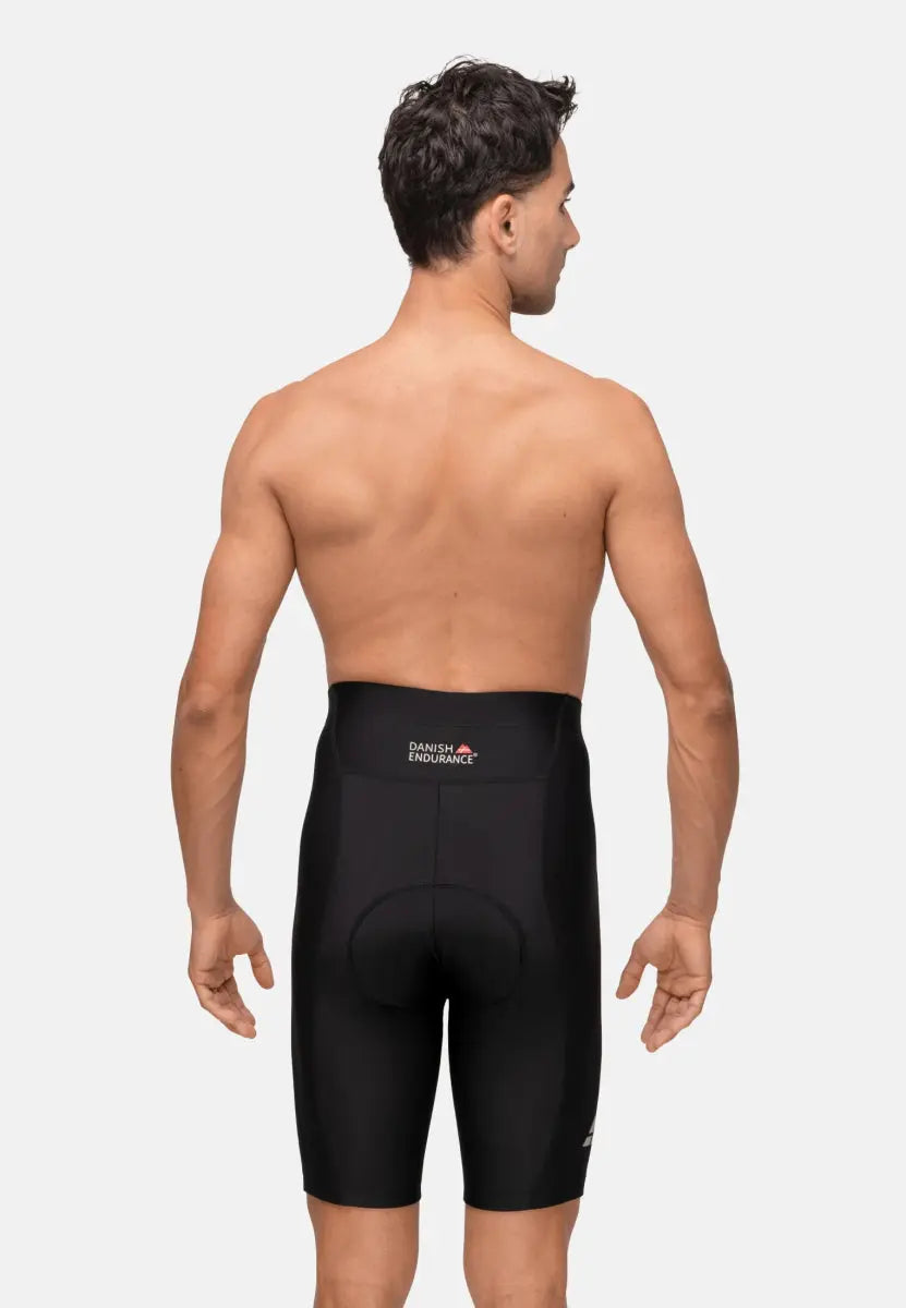 Shirtless man from the back wearing black padded bike shorts with "Danish Endurance" logo.