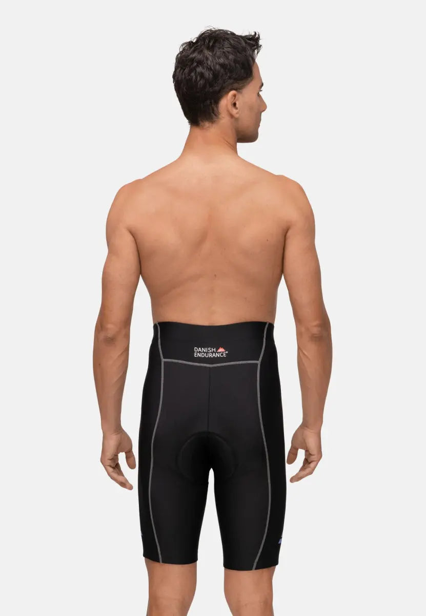 Man in black padded bike shorts, back view, showing stitching and "Danish Endurance" logo.