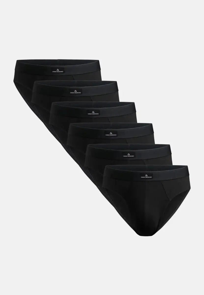 Six black cotton briefs arranged in a cascading pattern on a white background.