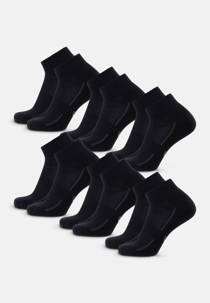 Nine pairs of black cotton quarter socks, neatly arranged in three rows.