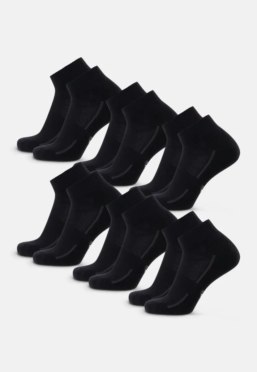 Nine pairs of black cotton quarter socks, neatly arranged in three rows.