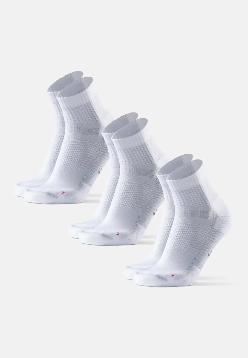 Three pairs of white kids running socks with ribbed cuffs and extra padding, neatly aligned.