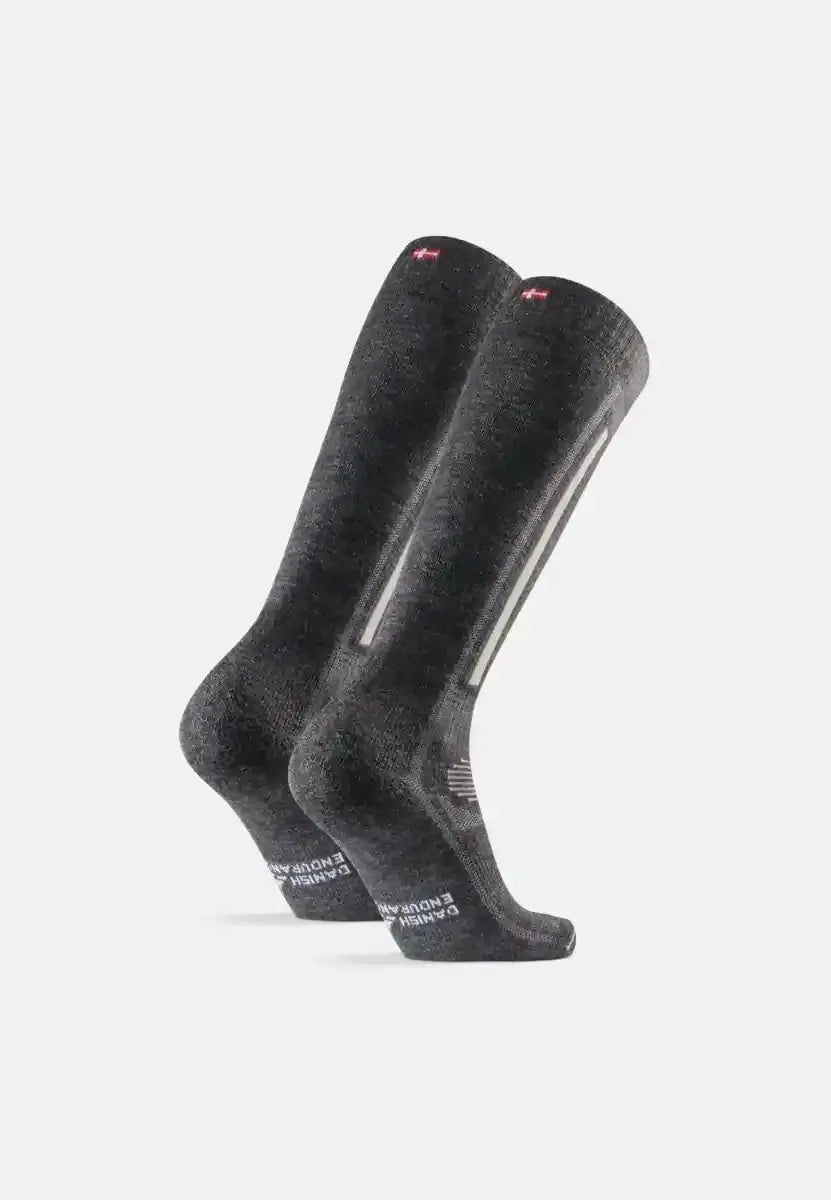 Dark gray knee-high merino wool ski socks with subtle texture and white branding on the sole.