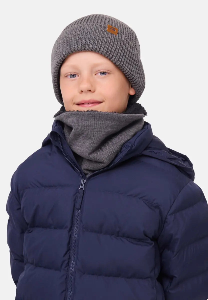 Child in gray beanie and neck warmer, wearing a navy puffer jacket.