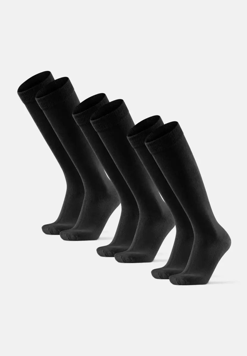 Six pairs of knee-high black bamboo socks arranged on a white background.