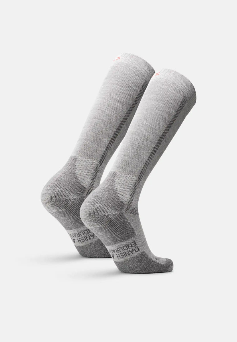 Gray knee-high merino wool hiking socks with reinforced heels and toes, angled side view.