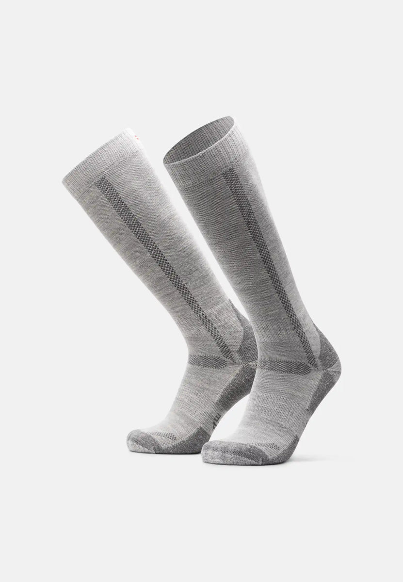 Gray knee-high merino wool hiking socks with ribbed texture and subtle pattern against a white background.