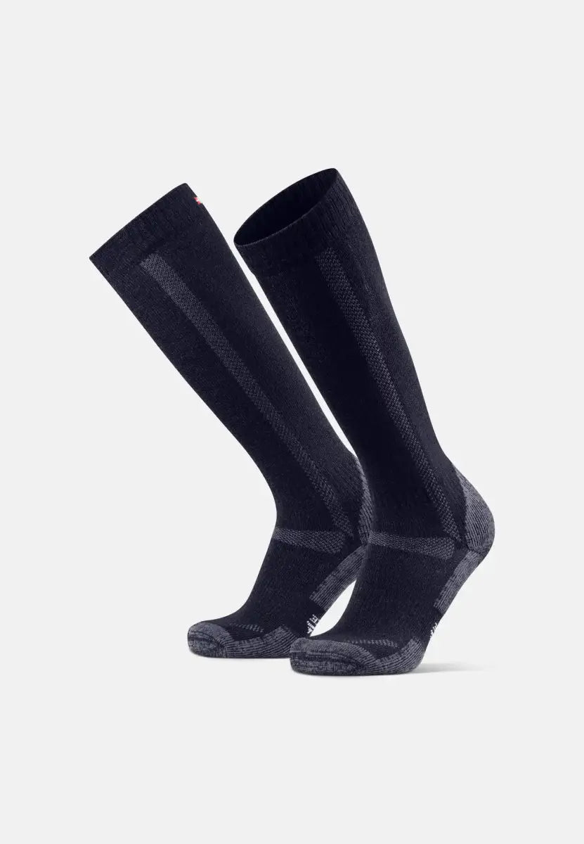 Dark knee-high merino hiking socks with textured patterns, reinforced heels, and toes.