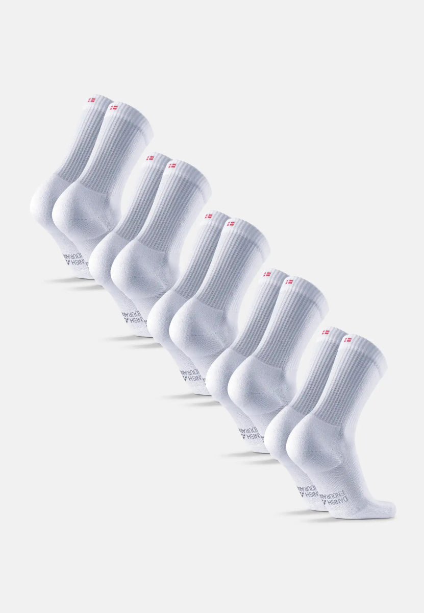 Six pairs of white crew running socks with ribbed cuffs and red logo detail.