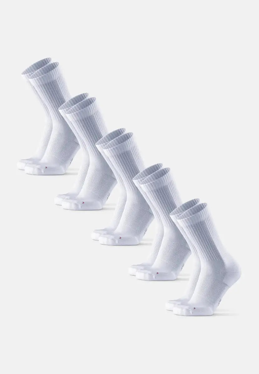 Five pairs of white crew running socks arranged diagonally on a plain background.