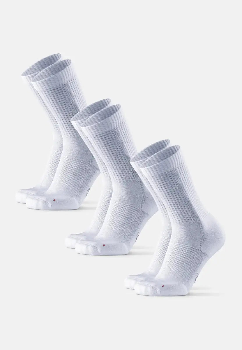 Three pairs of white crew running socks with ribbed cuffs, aligned diagonally on a plain background.