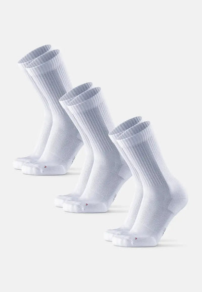 Three pairs of white crew running socks with ribbed cuffs, aligned diagonally on a plain background.