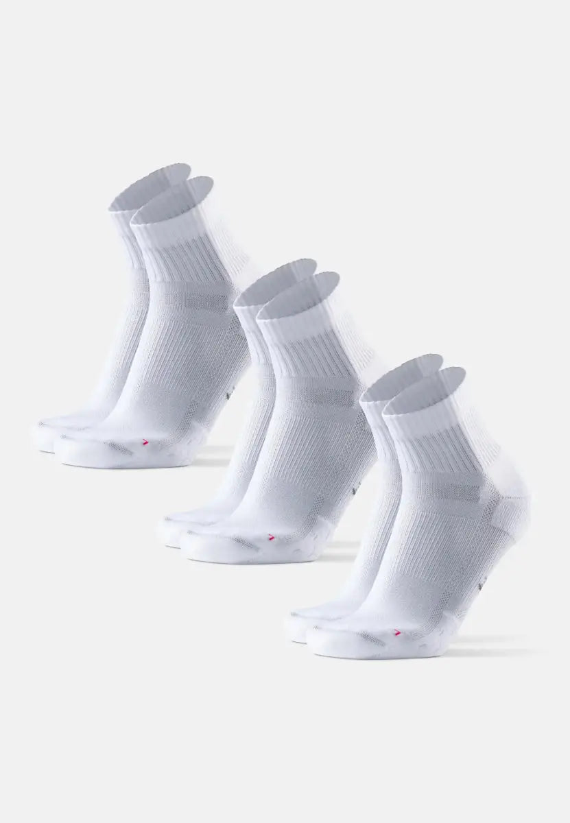 Three pairs of white running socks with ribbed cuffs, aligned diagonally on a plain background.