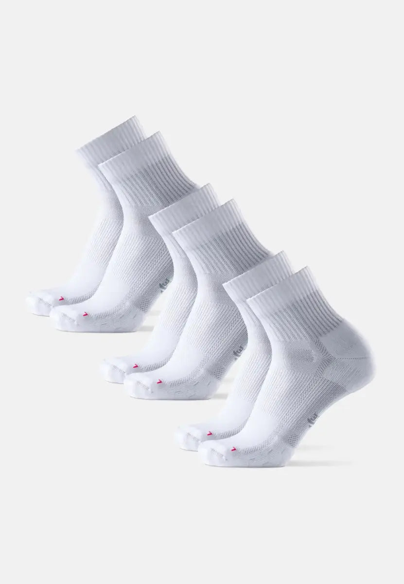 Four pairs of white long-distance running socks with ribbed cuffs and pink accents on toes.