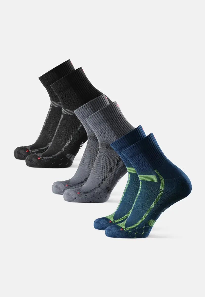 Three pairs of running socks in black, gray, and blue with green accents, displayed in a row.