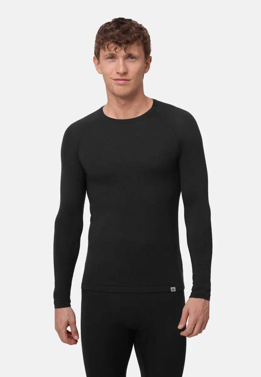 Man in black long-sleeve merino wool base layer shirt, standing and facing forward.