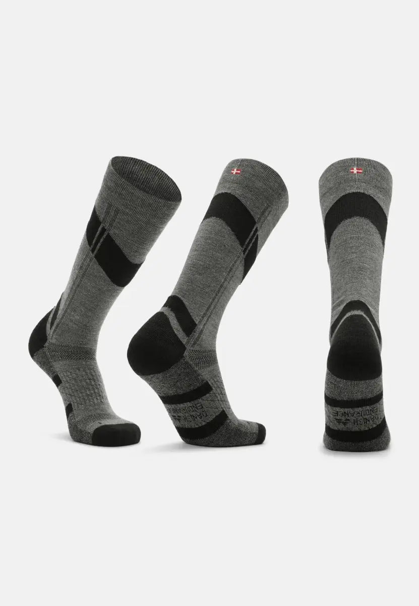 Three gray knee-high socks with black accents, compression zones, and a small flag detail.