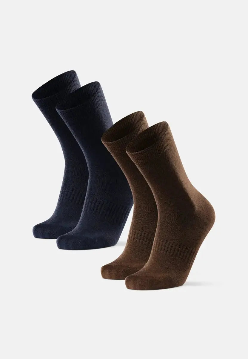 Two pairs of merino wool hiking liner socks, one navy and one brown, displayed upright.