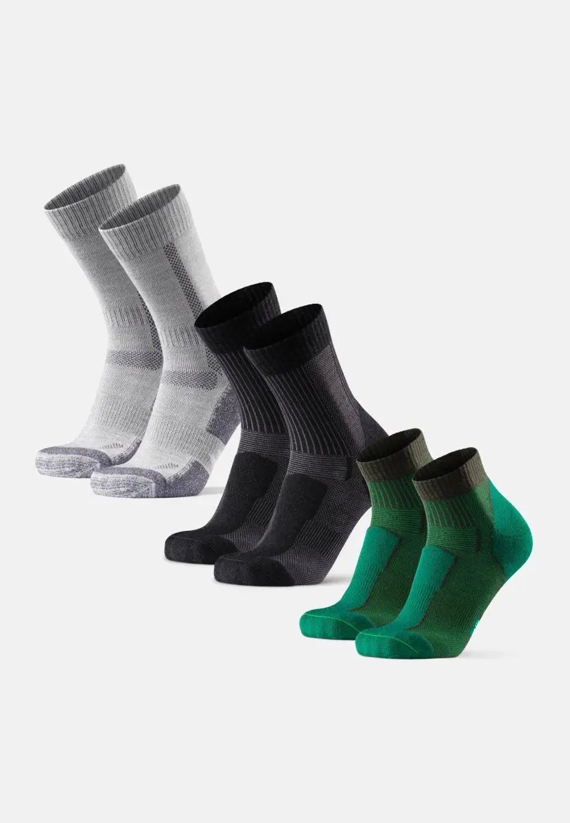 Three pairs of Merino wool socks in gray, black, and green, displayed in a row on a white background.