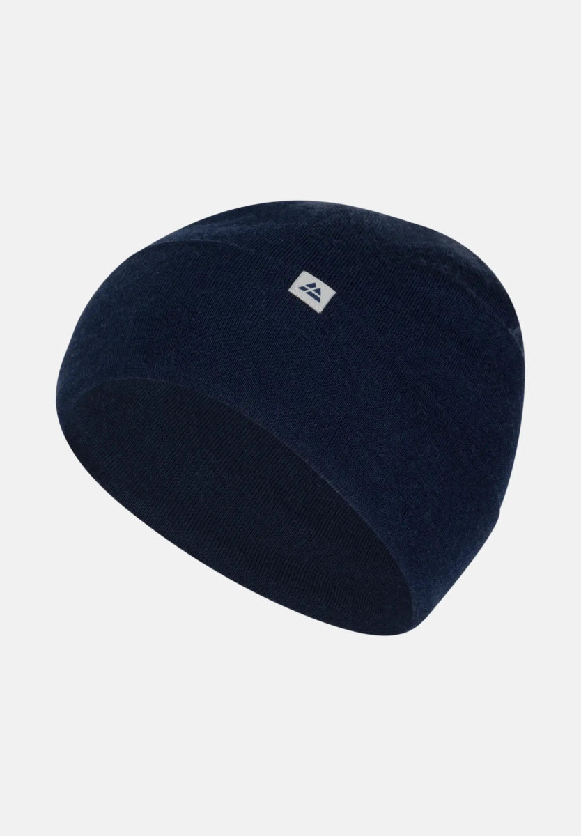 Dark blue Merino wool beanie with small white logo on front.