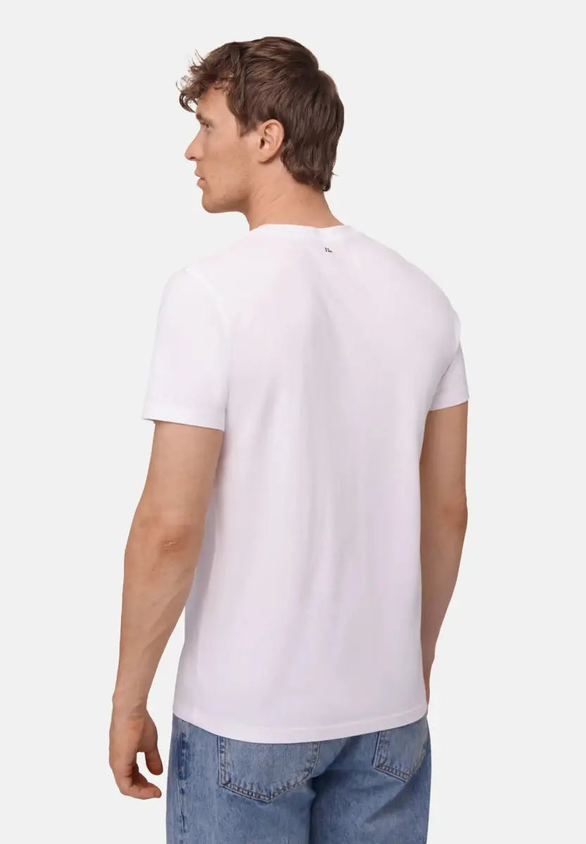 Man in white crew neck t-shirt and blue jeans, shown from the back.
