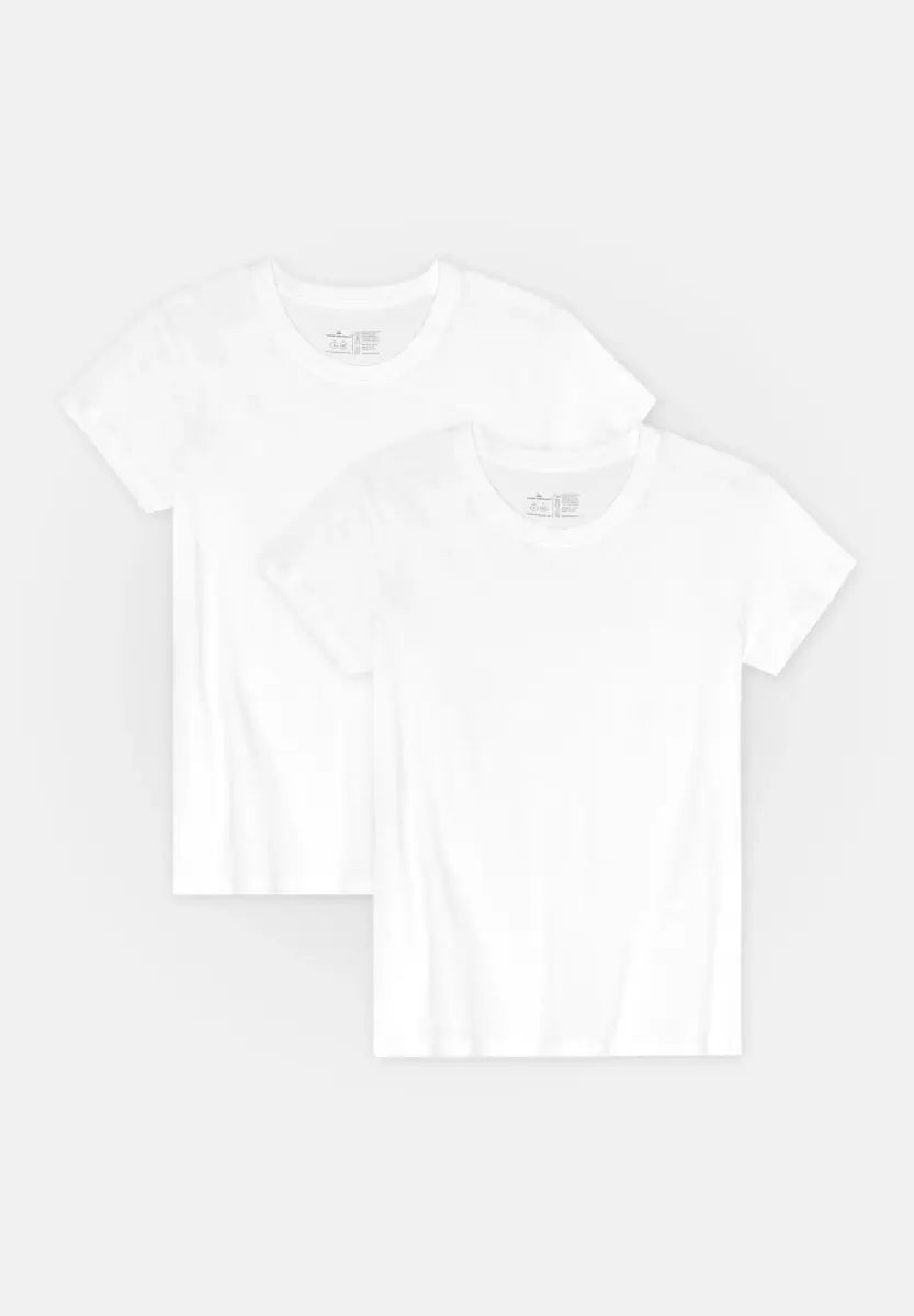 Two plain white crew neck T-shirts for women, neatly stacked on a light background.