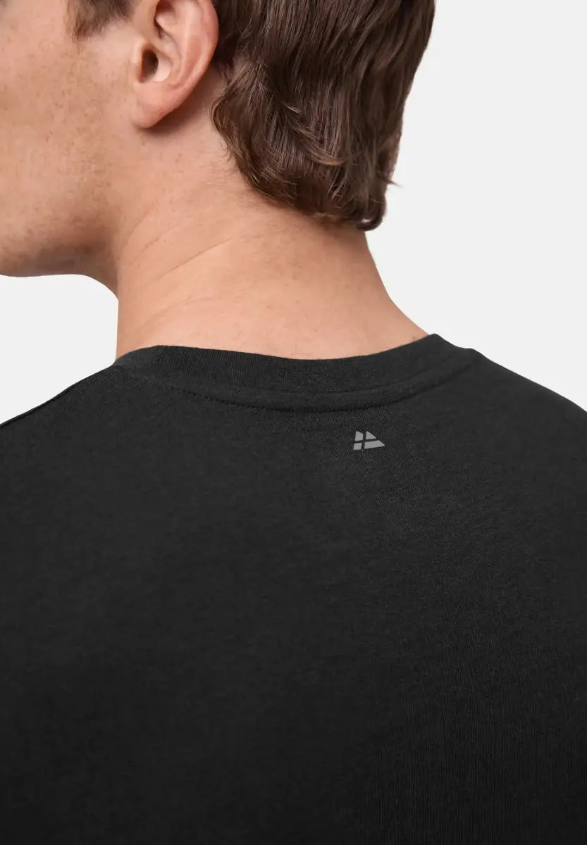 Back view of a man's neck and shoulder in black V-neck T-shirt with a small logo below the collar.