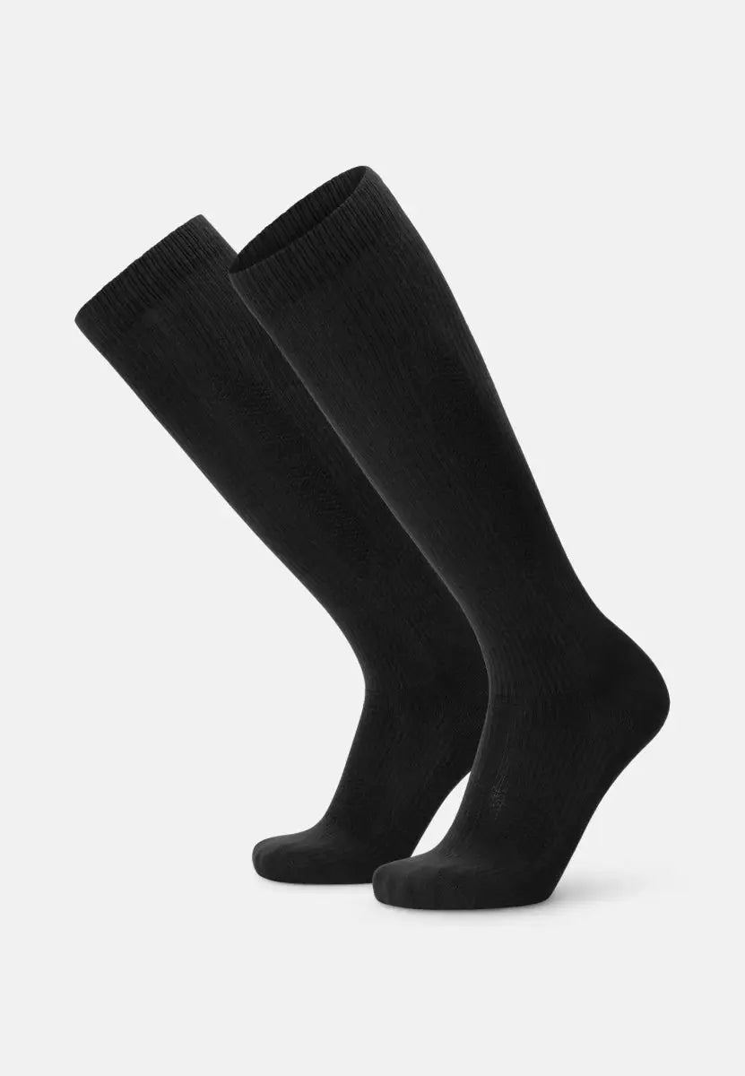 Black knee-high organic cotton compression socks with ribbed texture, shown side by side.
