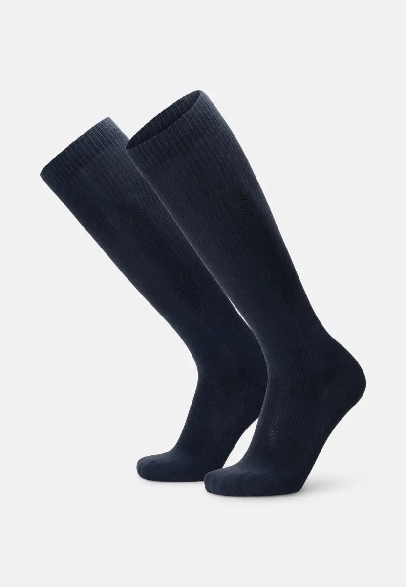 Knee-high dark ribbed compression socks, organic cotton, side view.