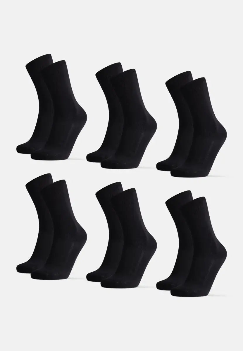 Six pairs of black organic cotton dress socks, neatly arranged on a white background.