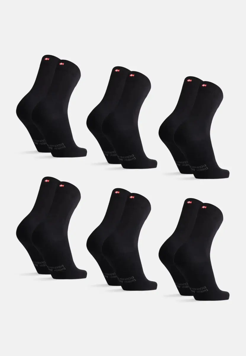 Six pairs of black socks with red logos, neatly arranged in two rows on a white background.