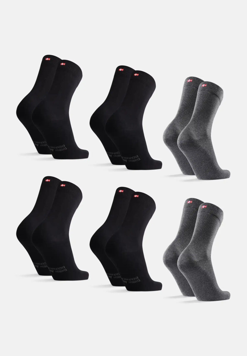 Six pairs of socks, black and gray, with flag detail near cuff, arranged in two rows.