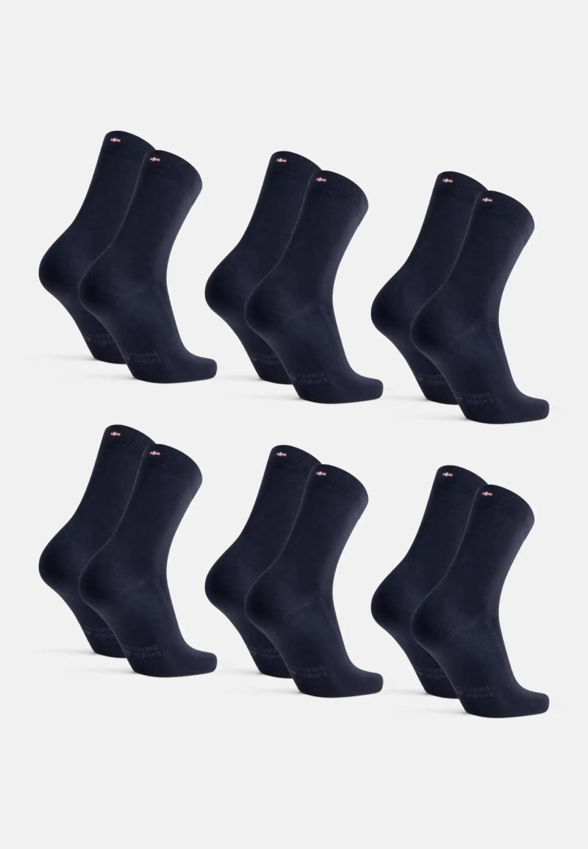 Six pairs of navy blue organic cotton dress socks, arranged in two rows on a white background.