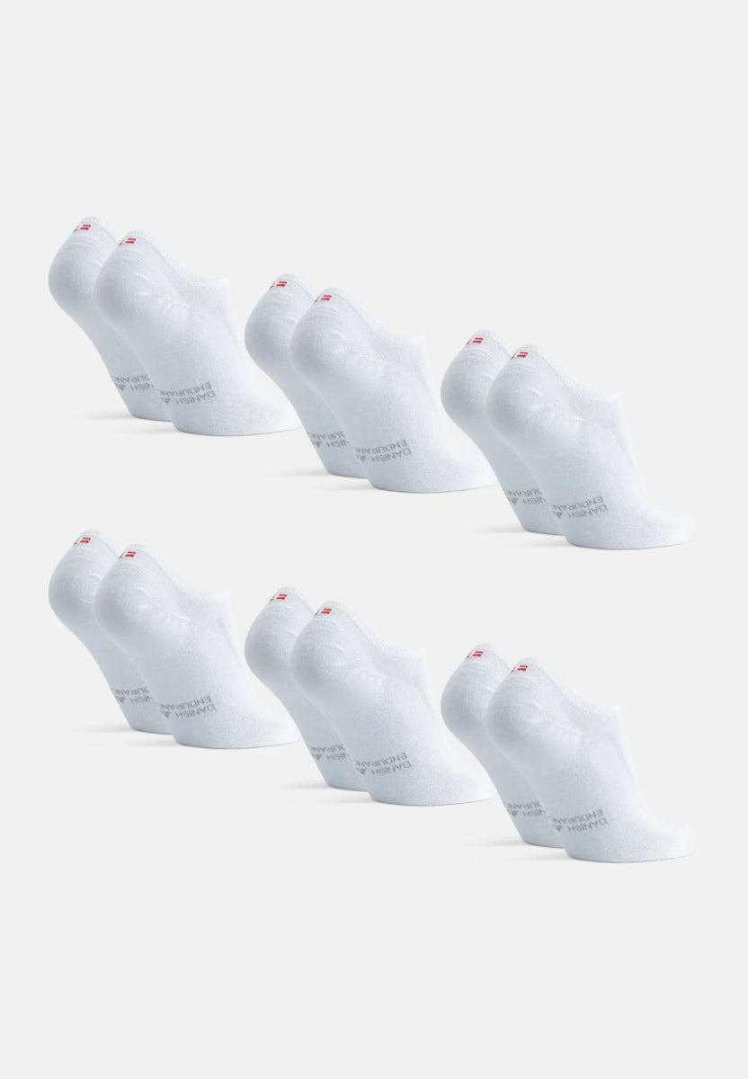 White organic cotton no-show socks arranged in two rows, each with a red logo on the heel.